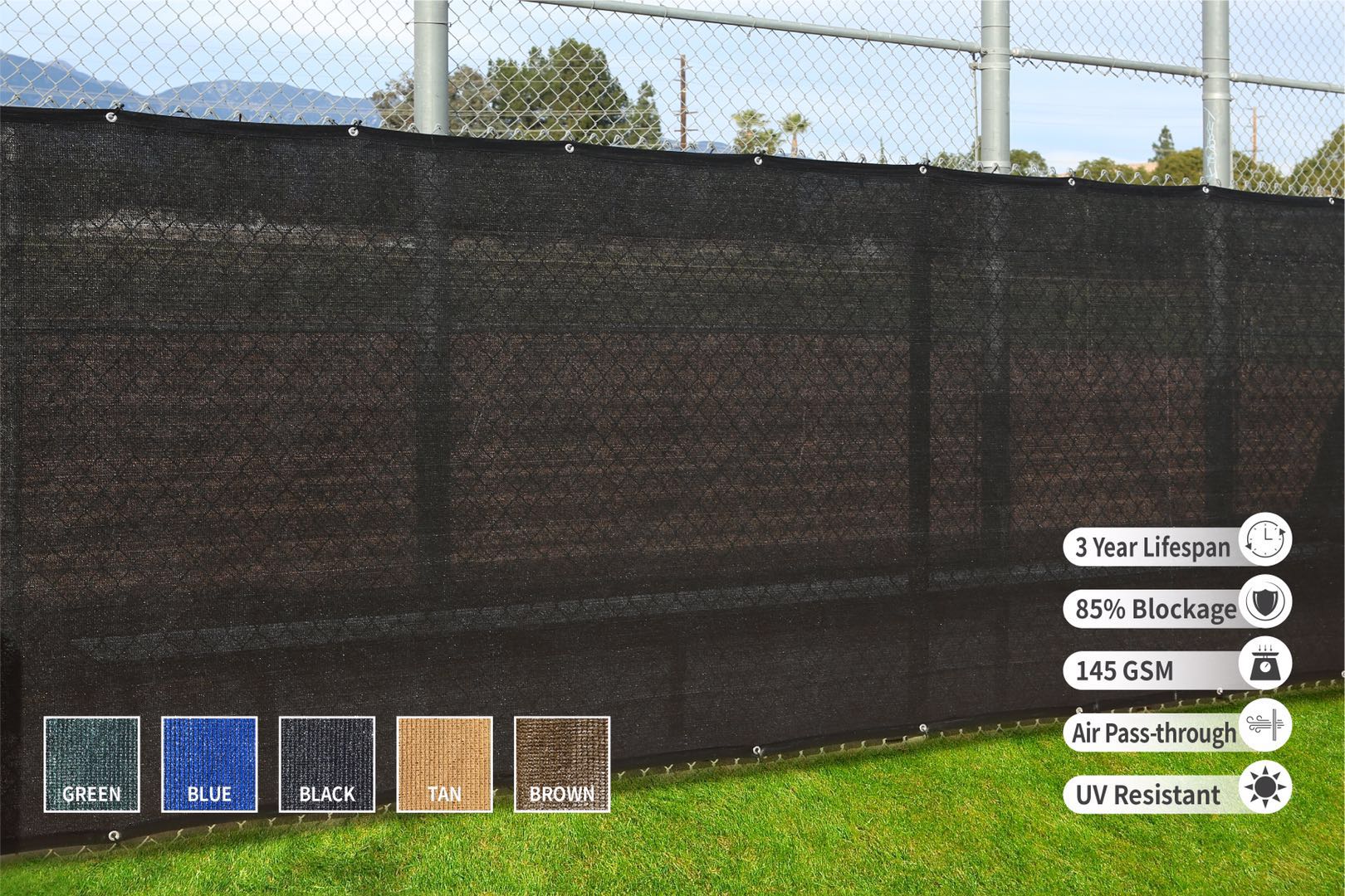 A privacy fence screen in black, installed on a fence, with a label indicating the product features such as color options, blockage percentage, lifespan, and UV resistance.